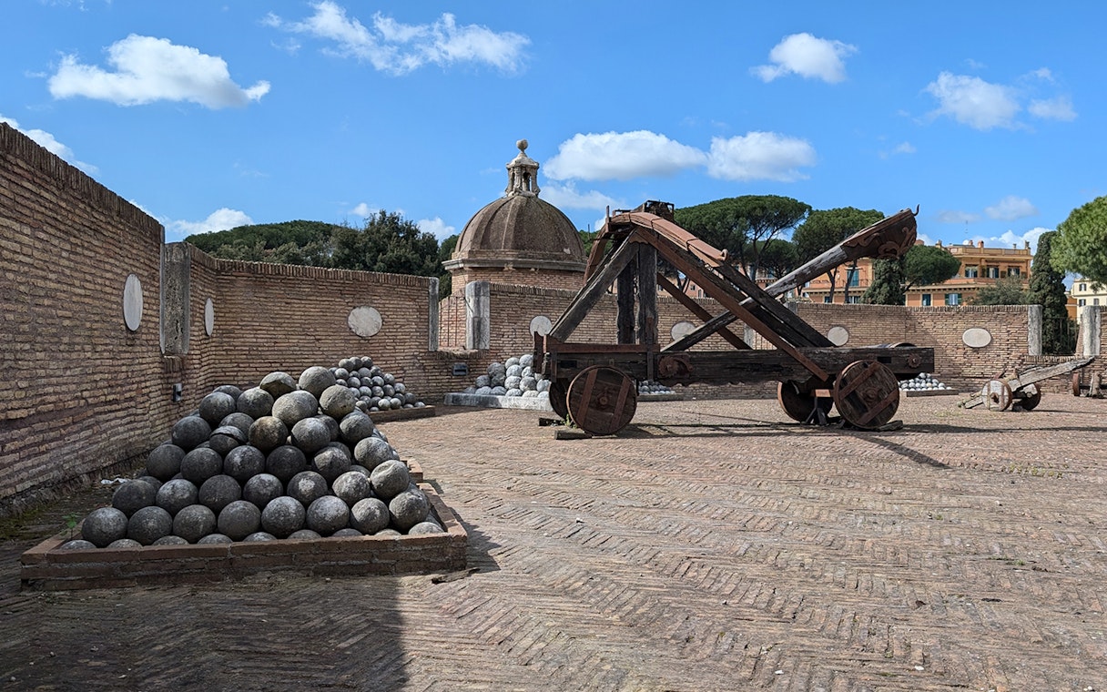 Cannons and catapult at Castel Sant'Angelo, Rome, with stone cannonballs.