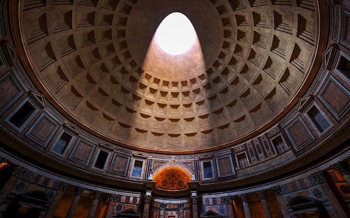 Oculus in the Pantheon dome, Rome, with sunlight streaming through.