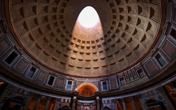Oculus in the Pantheon dome, Rome, with sunlight streaming through.