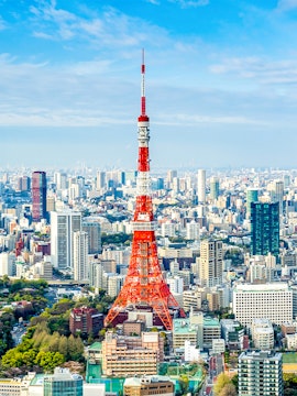 Tokyo Tower rising above the city skyline in Tokyo, Japan.
