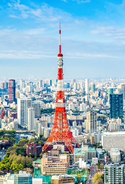 Tokyo Tower rising above the city skyline in Tokyo, Japan.