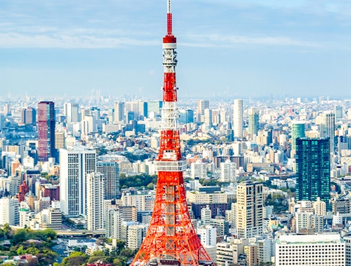 Tokyo Tower rising above the city skyline in Tokyo, Japan.