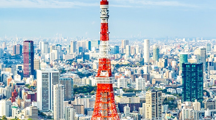 Tokyo Tower rising above the city skyline in Tokyo, Japan.