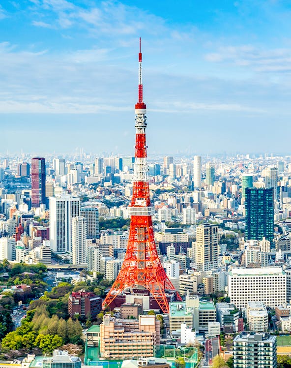 Tokyo Tower rising above the city skyline in Tokyo, Japan.