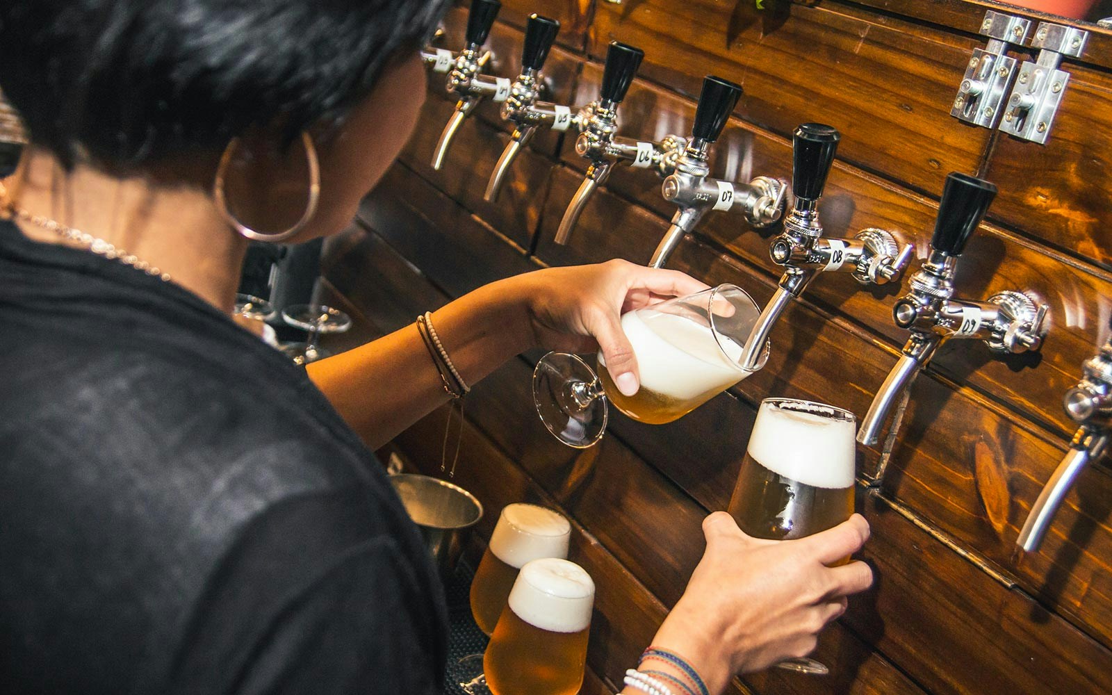 Prague beer tour with guide and tourists at historic Czech brewery.