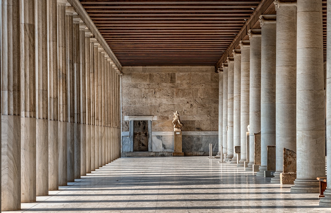 Inside view of the Stoa of Attalos in Athens, showcasing ancient columns and architectural details.
