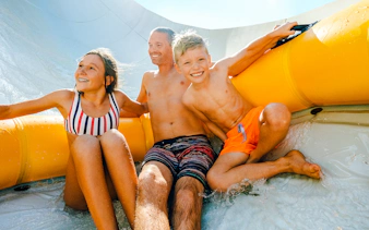 Family enjoying Mammoth Falls ride at Wet n Wild, Gold Coast.