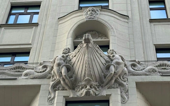 Facade sculpture on a historic building in Budapest, part of the Golden Age Sweet Tastes tour.
