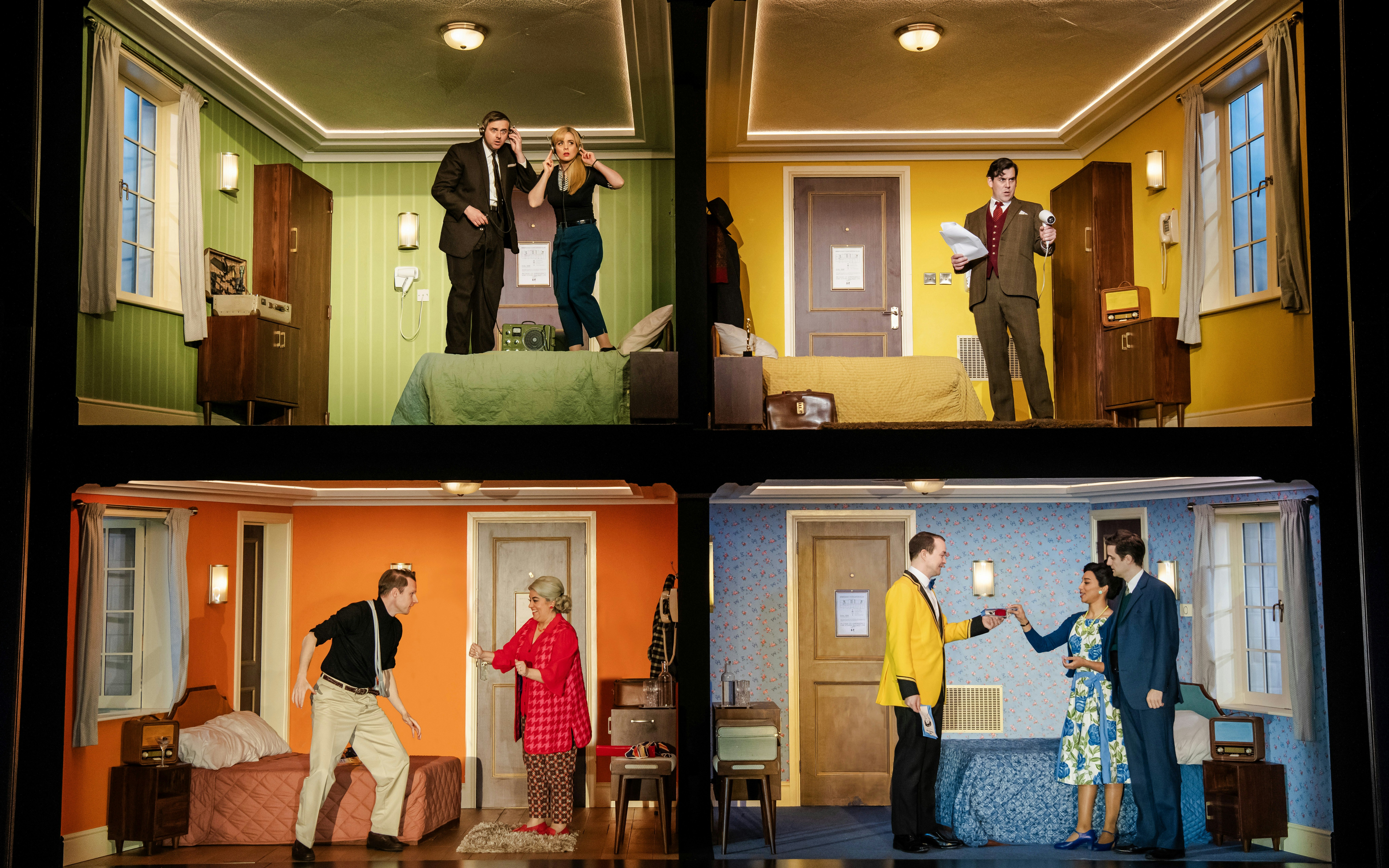 Actors performing scenes in a multi-room set for "The Comedy About Spies" production.