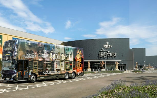 Tour bus at Harry Potter Warner Bros. Studio Tour entrance in London.