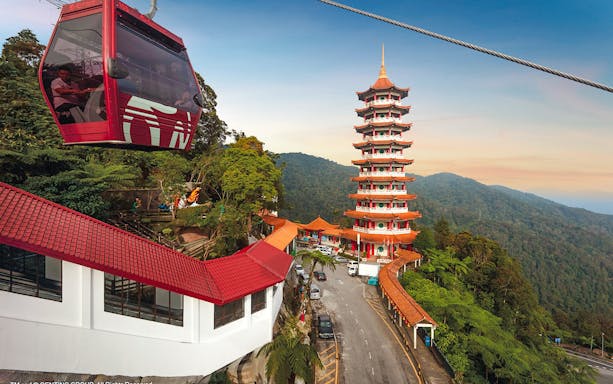 Genting Awana SkyWay gondola with Chin Swee Caves Temple in the background, Malaysia.