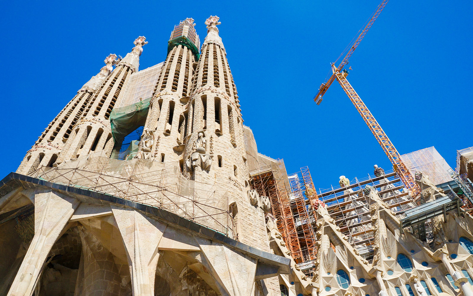 Sagrada Familia Passion façade with crane in Barcelona under construction