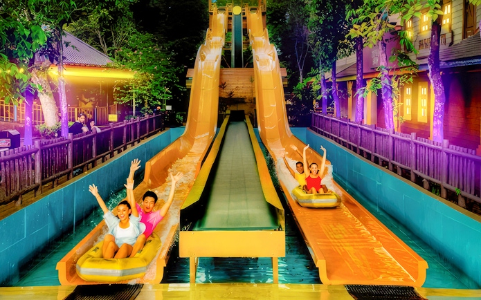 People enjoying water slides at Sunway Lagoon Night Park, Kuala Lumpur.