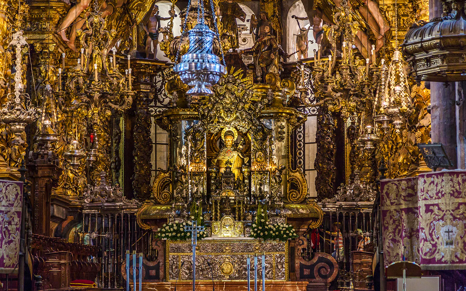 Statue of Saint James on ornate altar in Santiago de Compostela Cathedral.