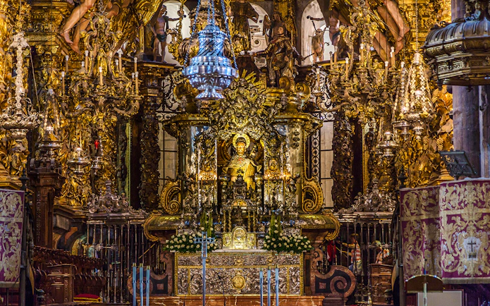 Statue of Saint James on ornate altar in Santiago de Compostela Cathedral.