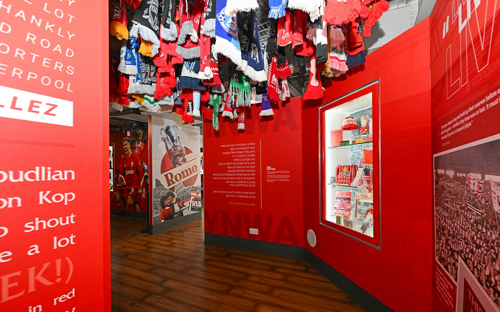 Tourists exploring Anfield, the Liverpool FC Stadium, on a guided tour from London by train