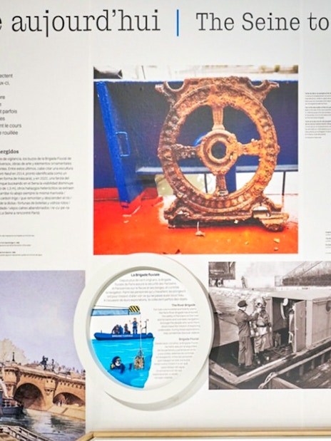 Paris Archaeological Crypt exhibit on Seine River history with artifacts and historical images.