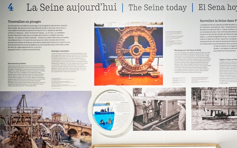 Paris Archaeological Crypt exhibit on Seine River history with artifacts and historical images.