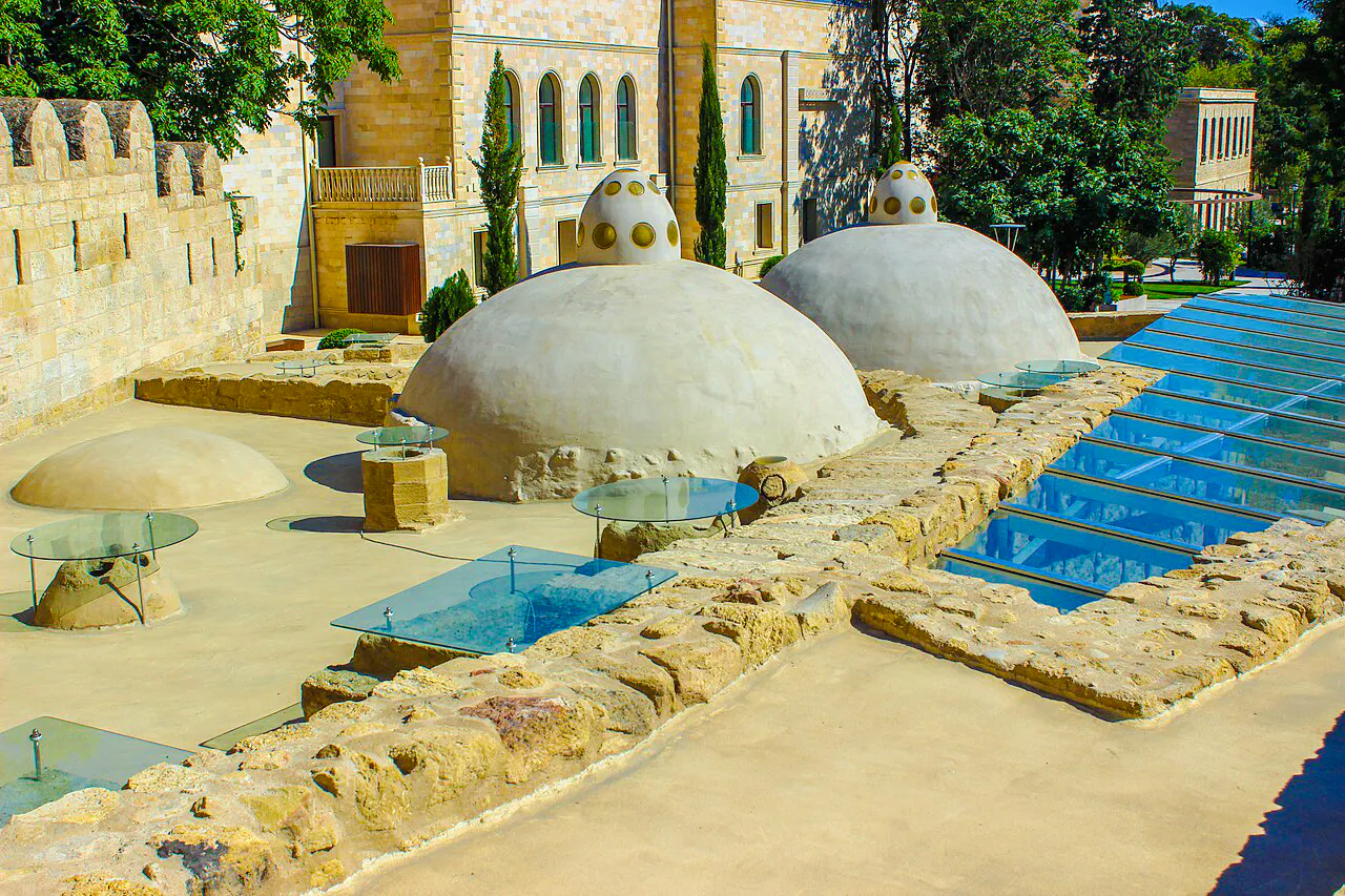 Underground hammam domes and glass skylights in Baku complex.