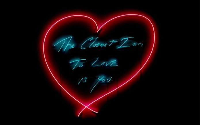 Neon heart artwork with text "The Closest I Am To Love Is You" at Moco Museum London.