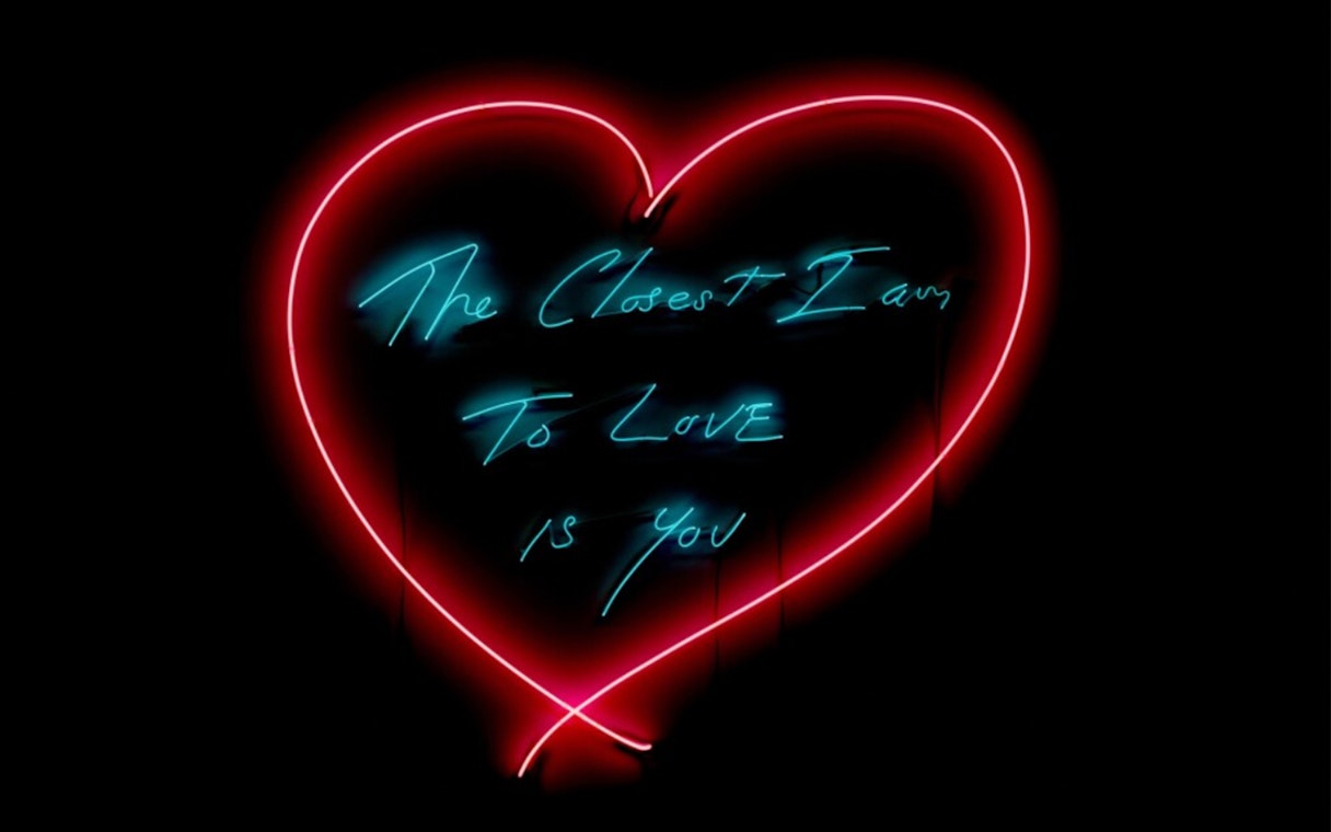 Neon heart artwork with text "The Closest I Am To Love Is You" at Moco Museum London.
