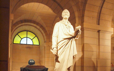 Voltaire statue in Paris Pantheon crypt.