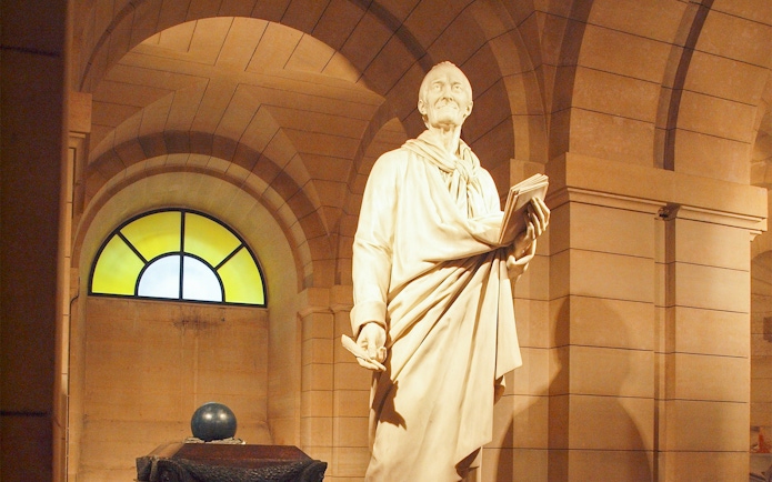 Voltaire statue in Paris Pantheon crypt.
