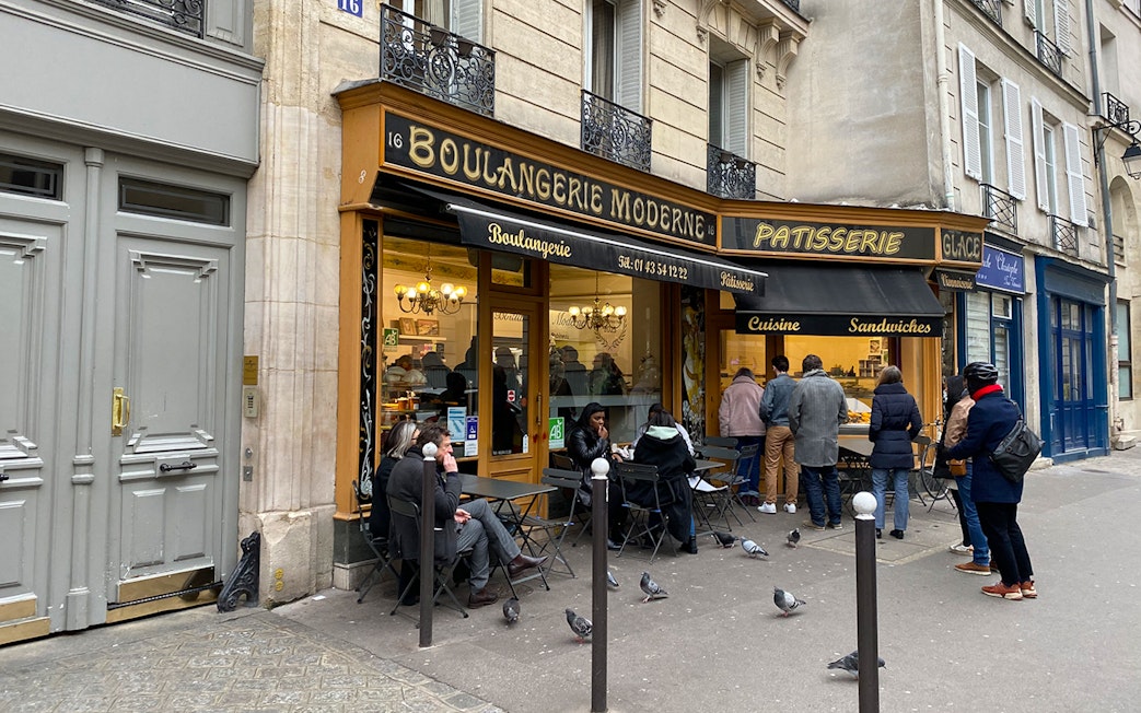 People outside Boulangerie Moderne in Paris during Emily in Paris Selfie Tour.