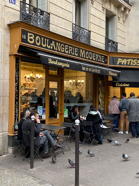 People outside Boulangerie Moderne in Paris during Emily in Paris Selfie Tour.