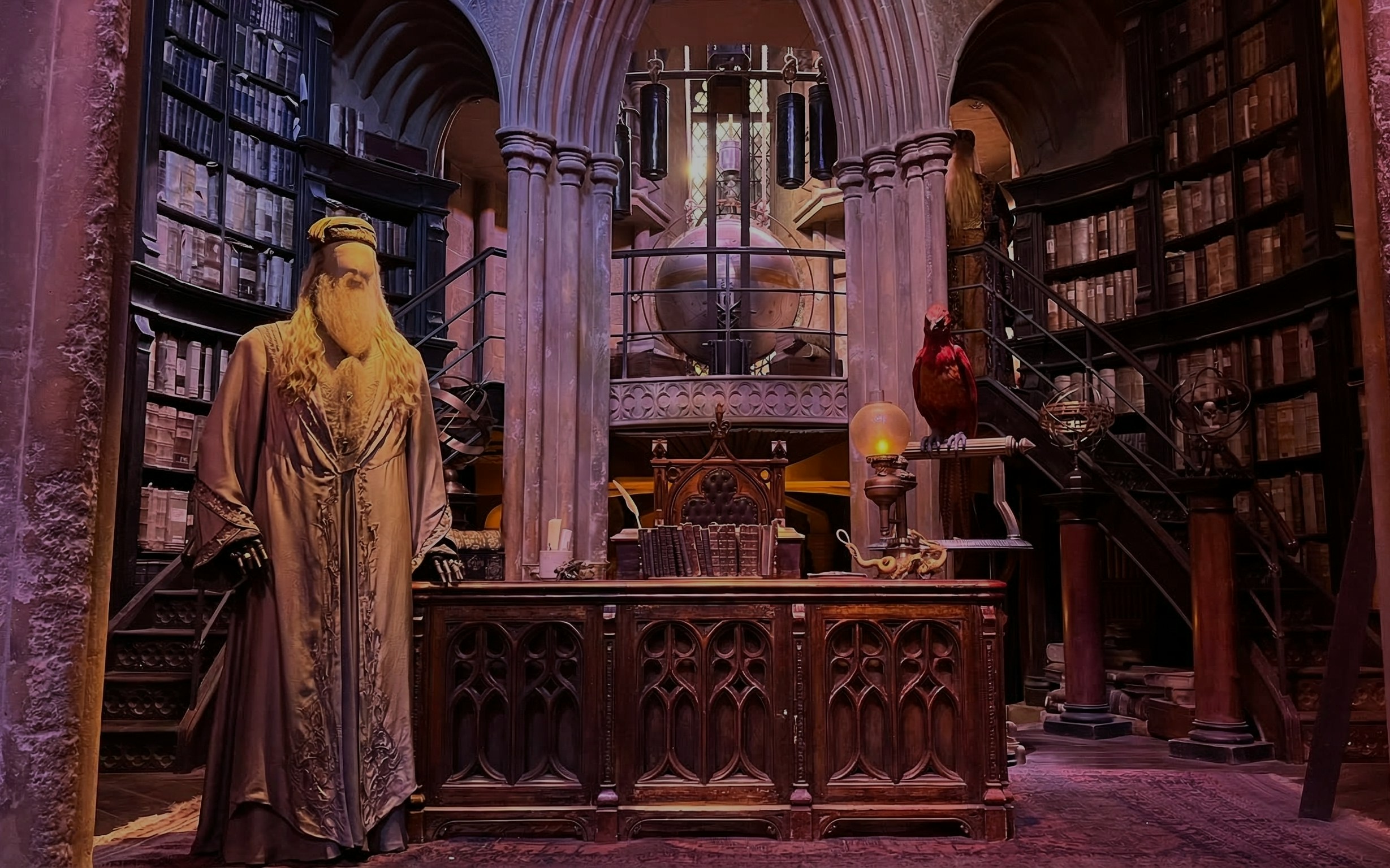 Dumbledore's office set at Harry Potter Studio Tour London with books and phoenix.