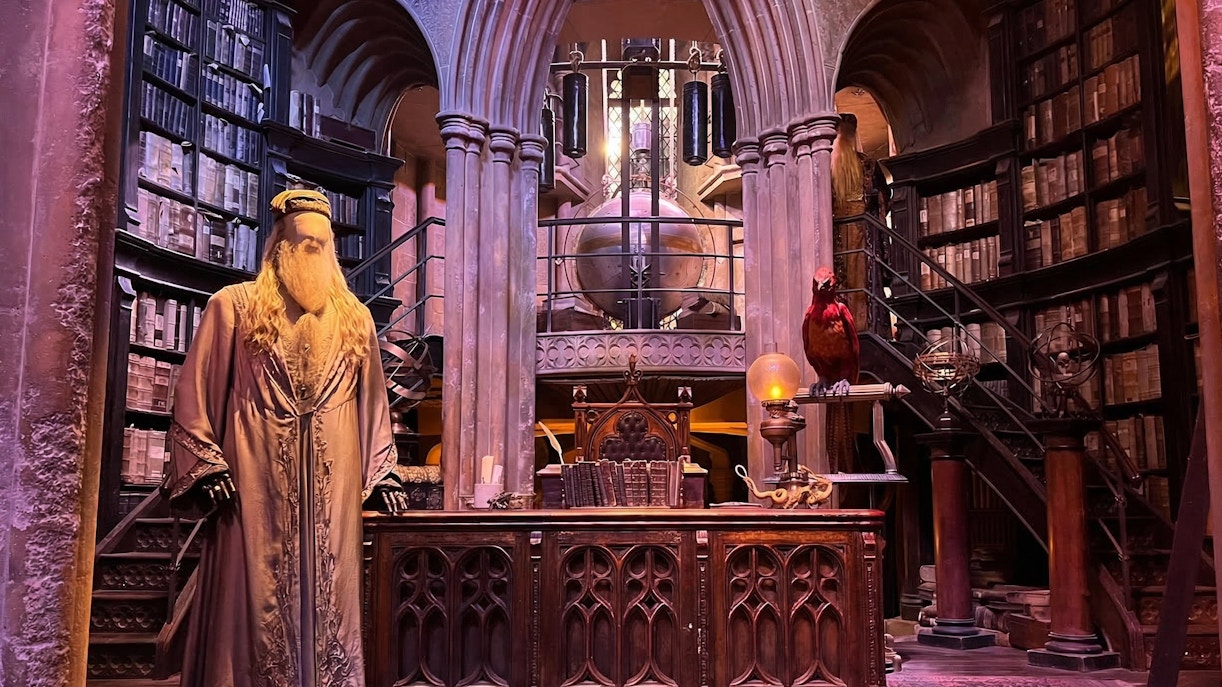 Dumbledore's office set at Harry Potter Studio Tour London with books and phoenix.