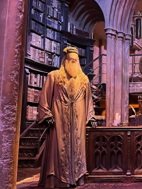 Dumbledore's office set at Harry Potter Studio Tour London with books and phoenix.