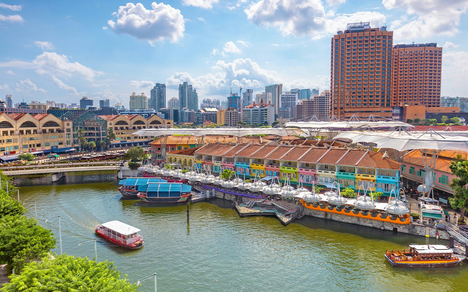 Aerial view of Clarke Quay, Singapore, showcasing vibrant riverside buildings and bustling nightlife.
