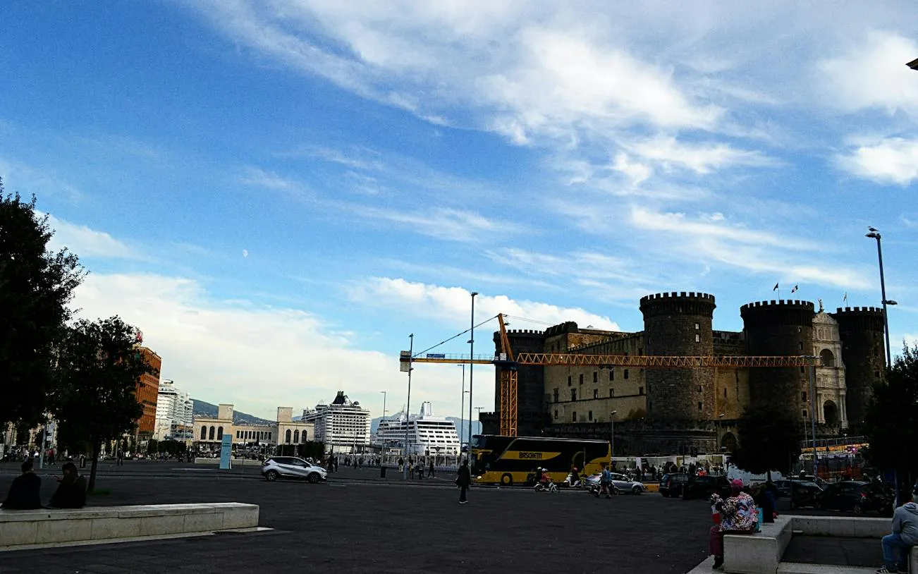 Castel Nuovo and cruise ships in Naples, Italy, part of a self-guided city exploration game.