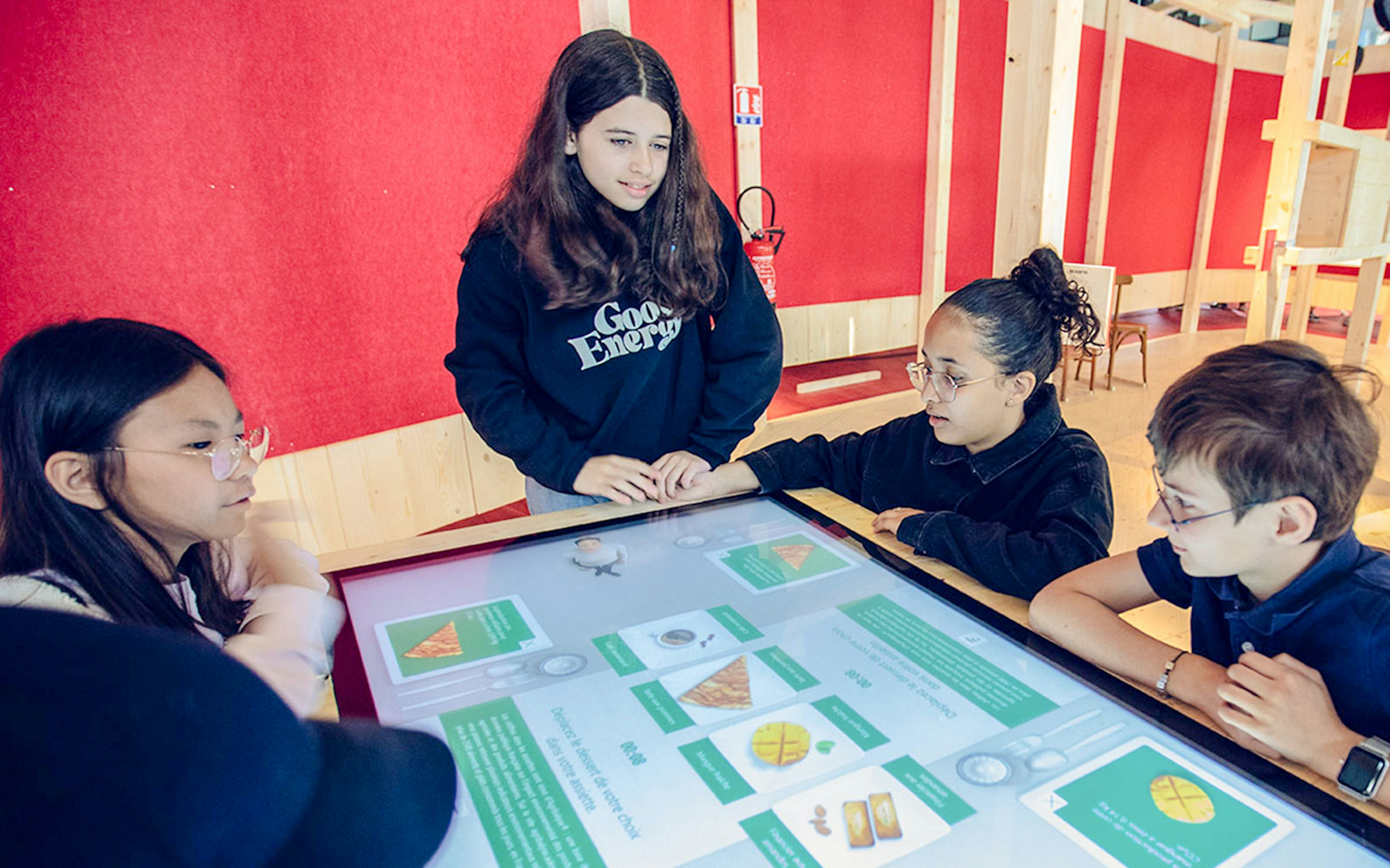 Children exploring interactive exhibits at Science & Industry Museum, Paris, France.