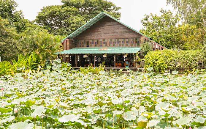 Thai cooking class venue at Mama Noi in lush organic garden.