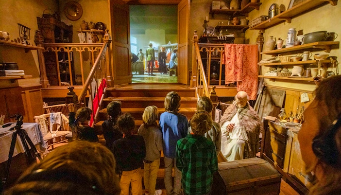 Visitors exploring Historium Bruges exhibits with optional virtual reality experience.