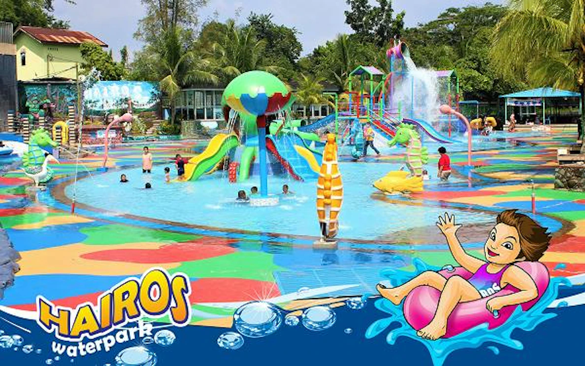 Children playing in colorful pools at Hairos Waterpark, Dubai, with slides and water features.