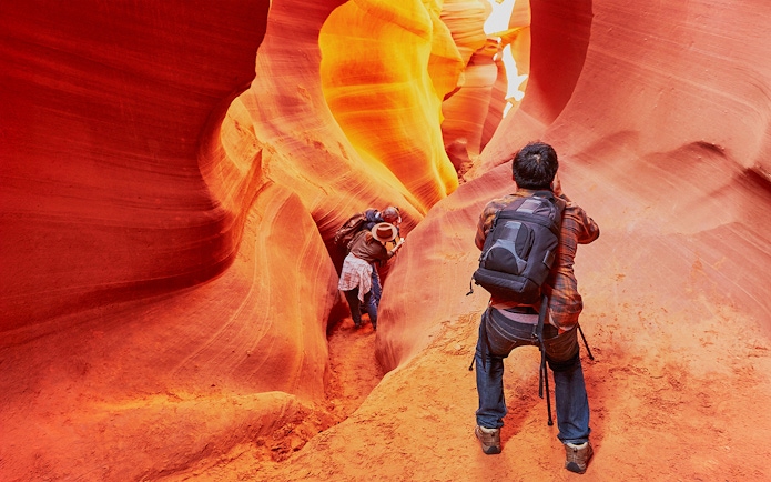 Exploring the narrow passageways of Lower Antelope Canyon, Arizona.