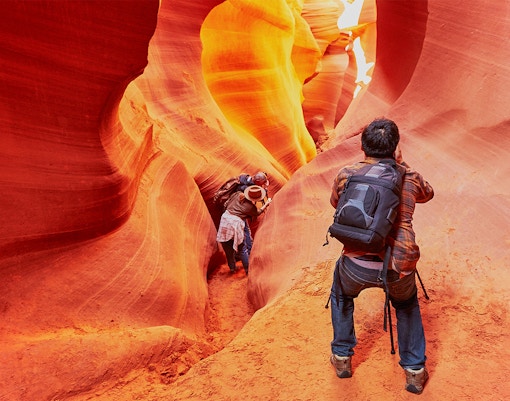 Exploring the narrow passageways of Lower Antelope Canyon, Arizona.