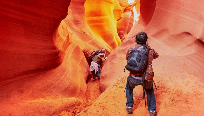 Exploring the narrow passageways of Lower Antelope Canyon, Arizona.