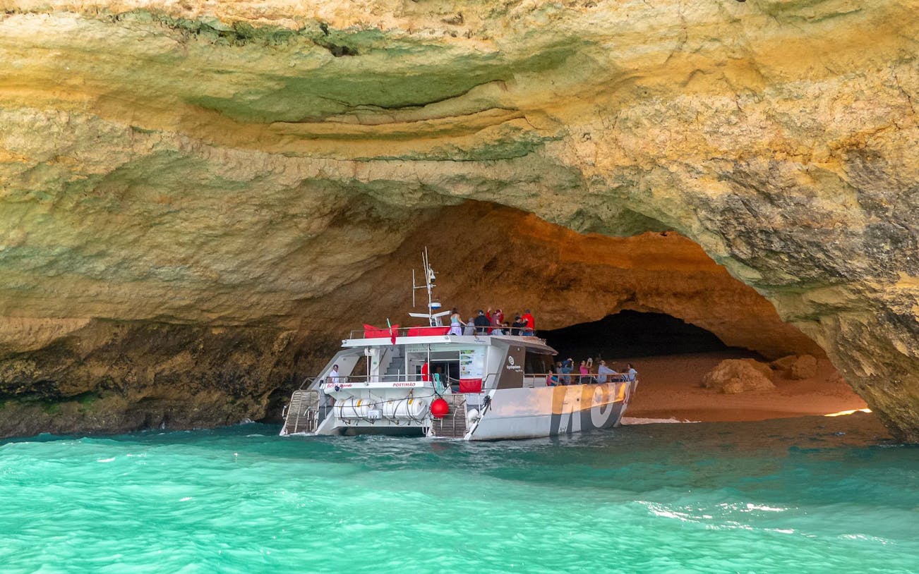 Boat entering Benagil Caves in Algarve, Portugal.