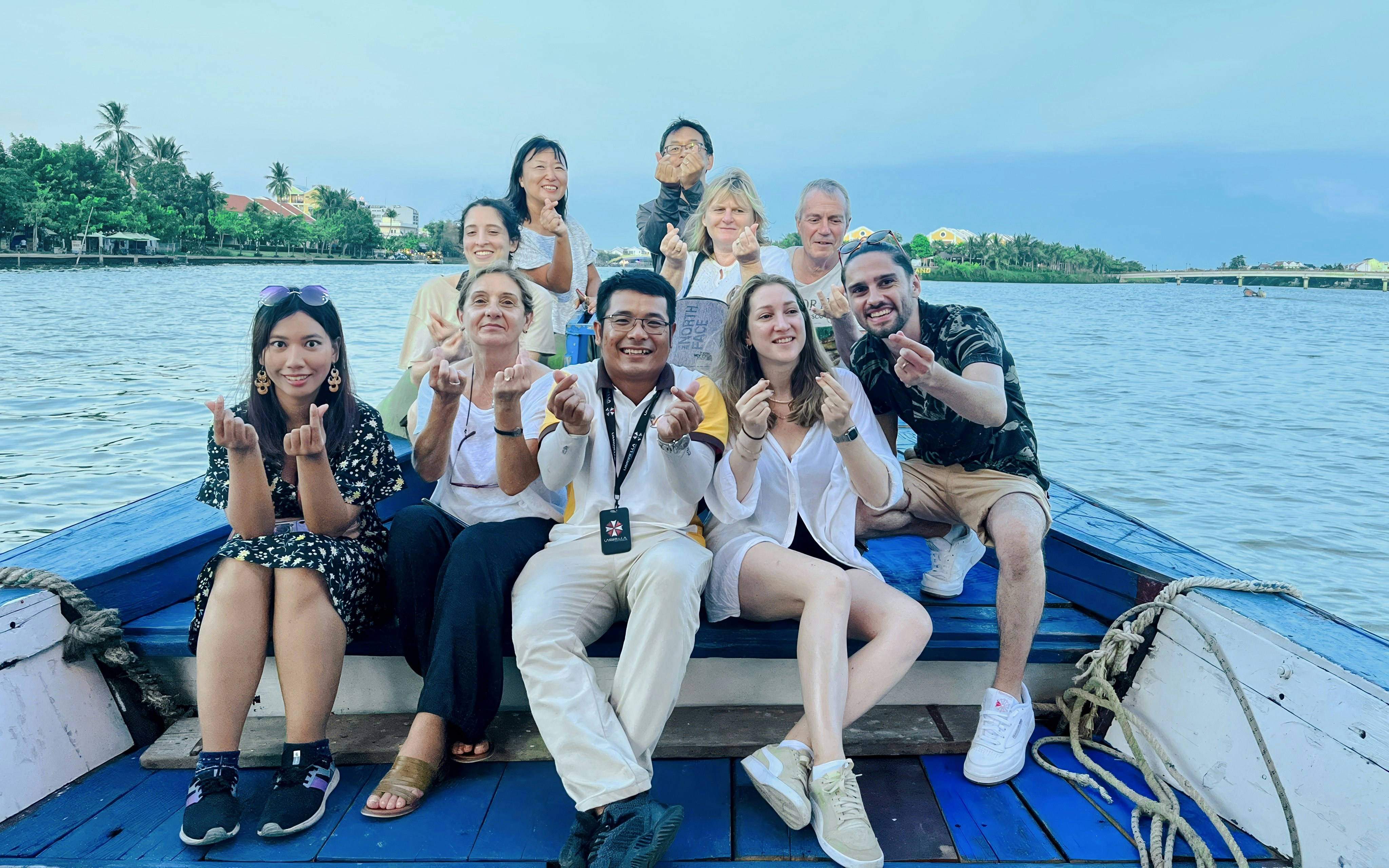 Group enjoying a boat tour on the river in Hoi An, Vietnam.