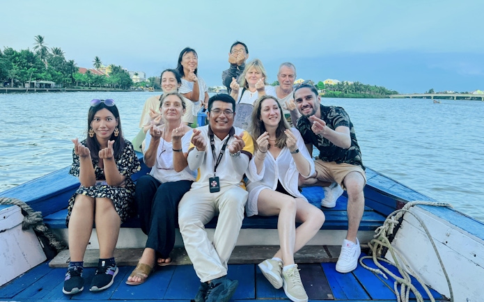 Group enjoying a boat tour on the river in Hoi An, Vietnam.