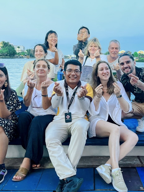Group enjoying a boat tour on the river in Hoi An, Vietnam.