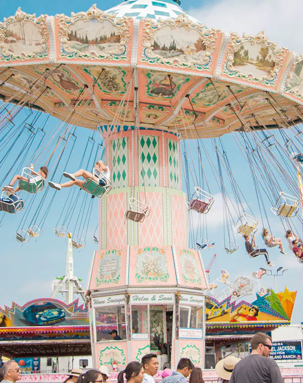 Wave swinger ride at Chimelong Paradise with people enjoying the swings.
