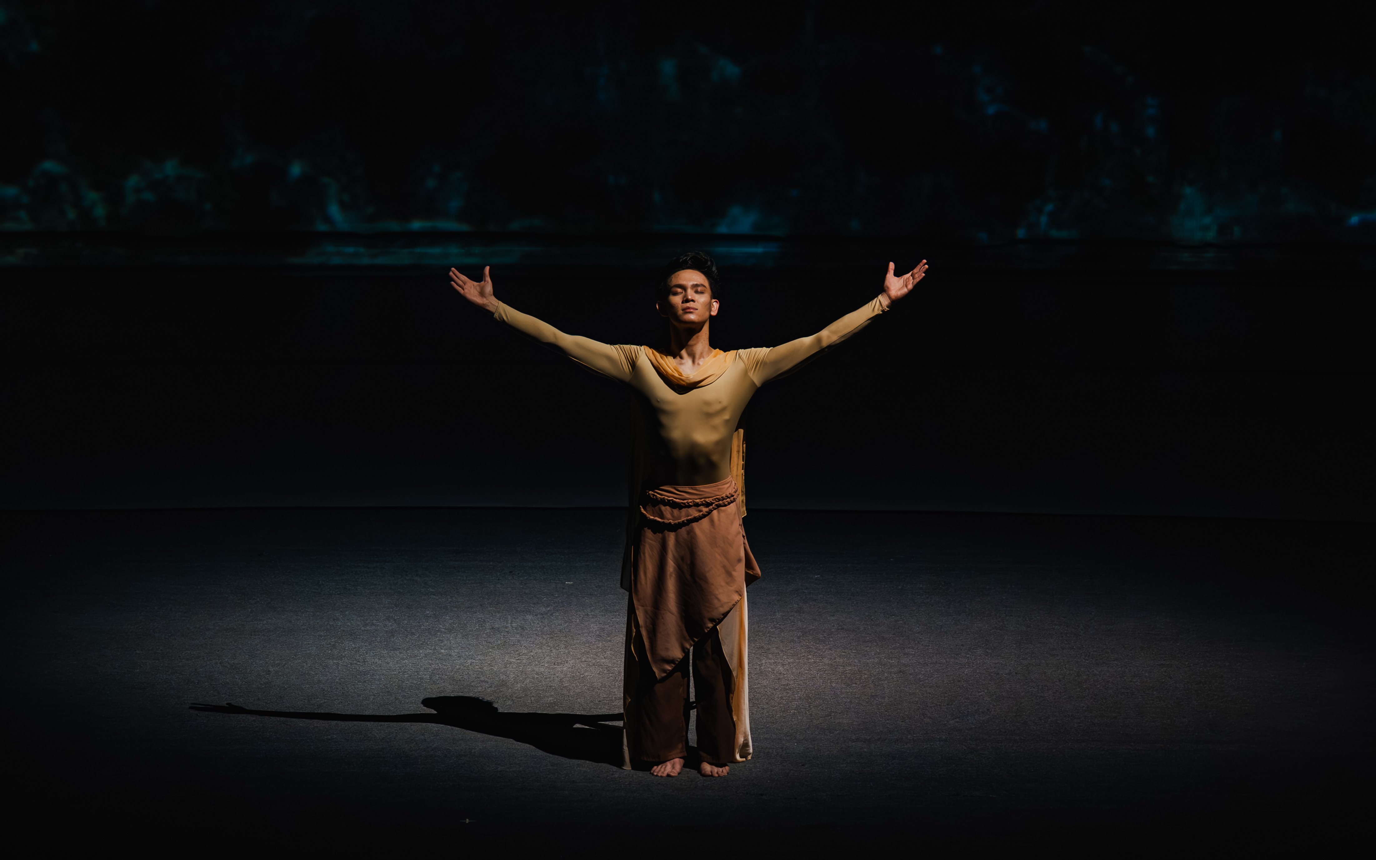 Performer with arms outstretched at The Legacy of a Generation Show.