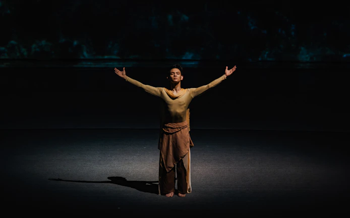 Performer with arms outstretched at The Legacy of a Generation Show.