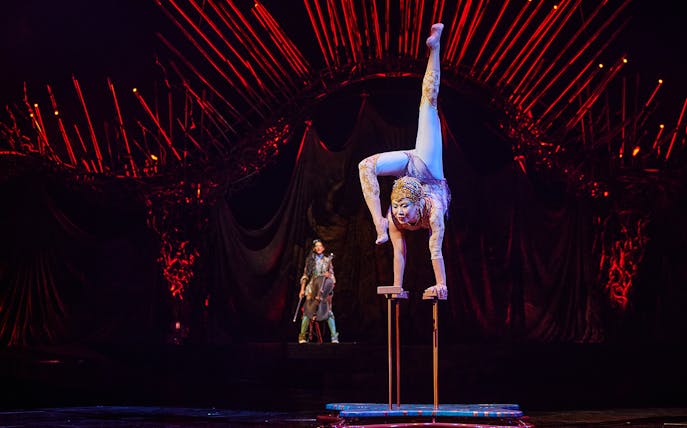Acrobat performing handstand at Cirque du Soleil: Alegría in Seville.