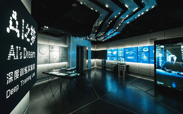 AI Dream Immersive Theater interior with digital displays and futuristic design.